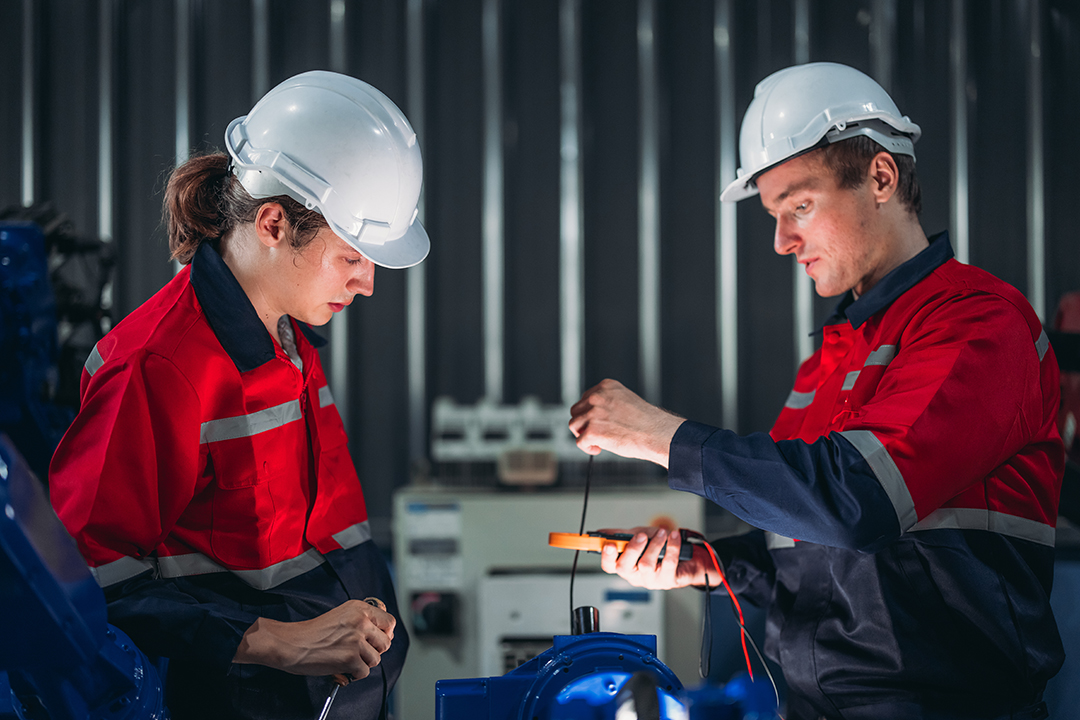 Technician Conducting Electrical Safety Check on Robot